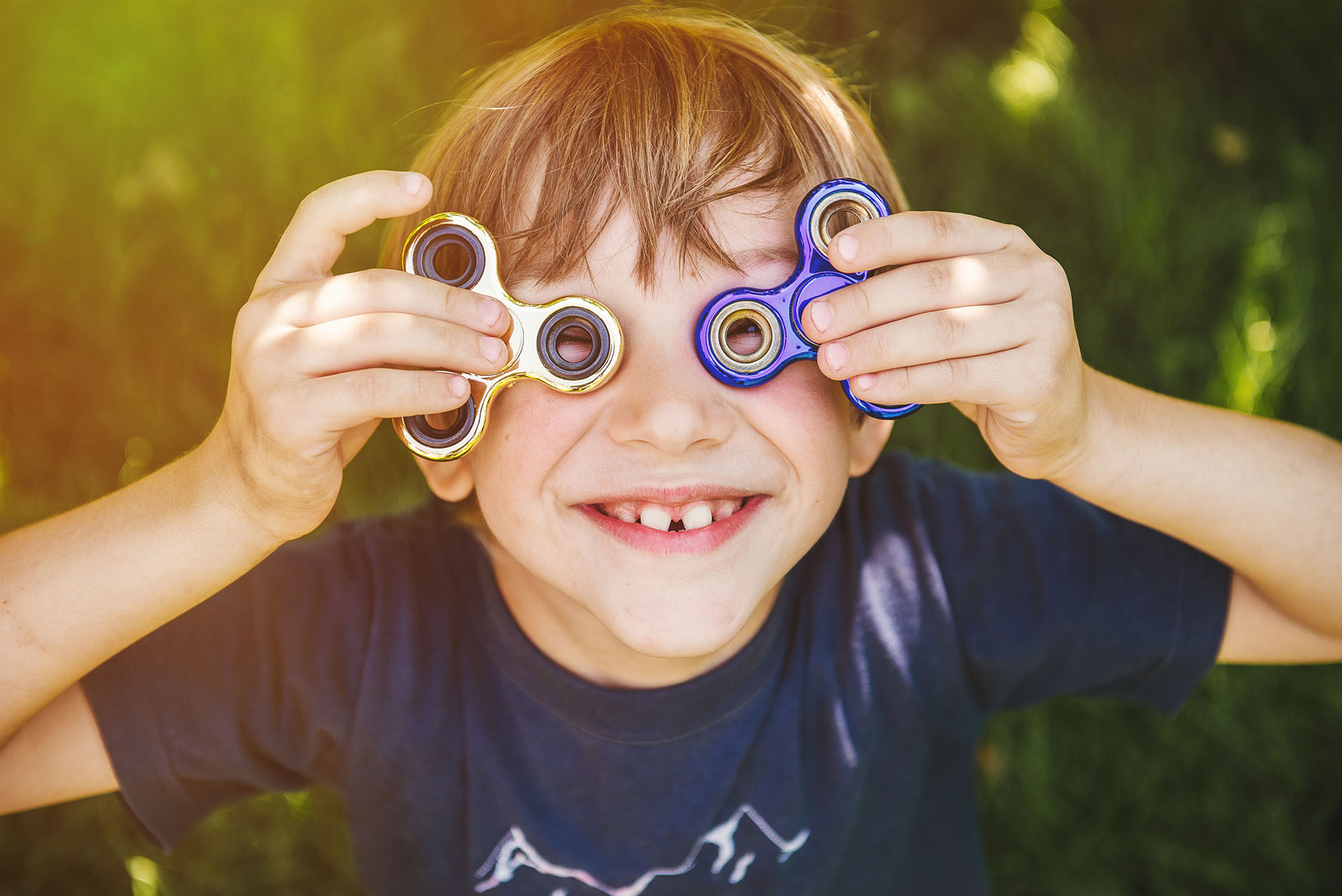 Child with fidget spinners