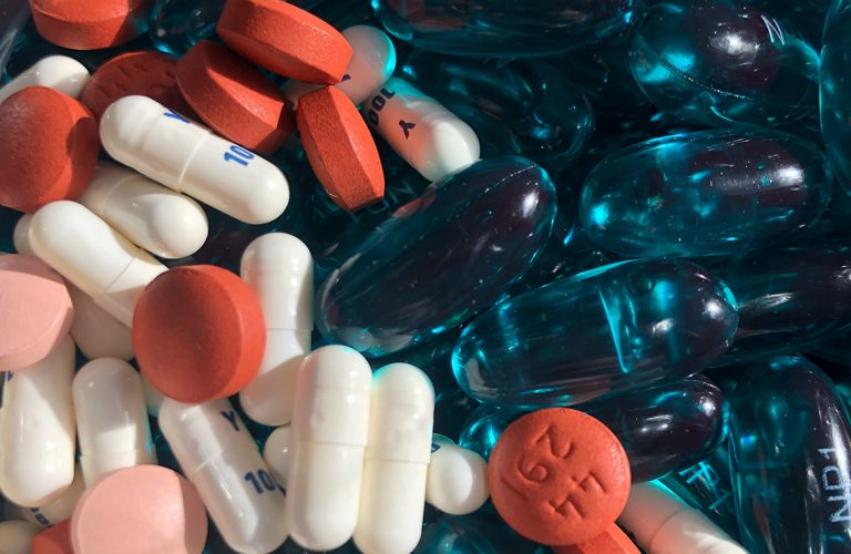 a macro image of tablets of different shapes and colors