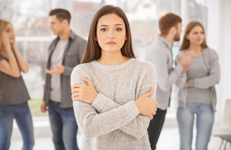 Sad woman during group therapy, indoors