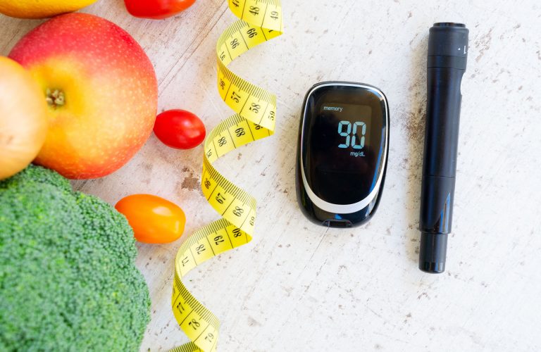 raw vegetables with blood glucose meter and lancet, diabetes healthy diet concept